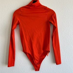 Skims red bodysuit